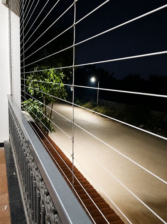 Bhagavan Enterprises team installing invisible grills at a Bangalore apartment